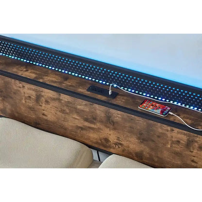 Wooden Bed surface with LED strip lighting and a smartphone charging cable.