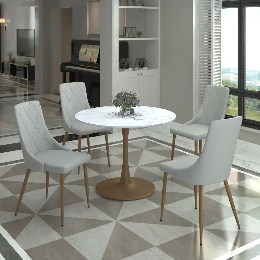 Modern dining room with a round table and four chairs on a geometric patterned floor.