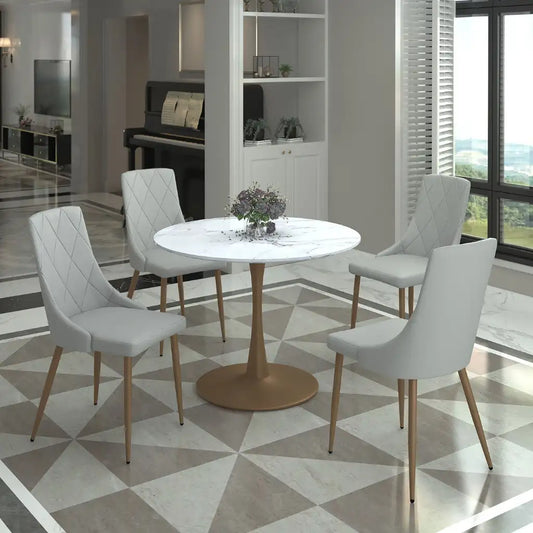 Modern dining room with a round table and four chairs on a geometric patterned floor.