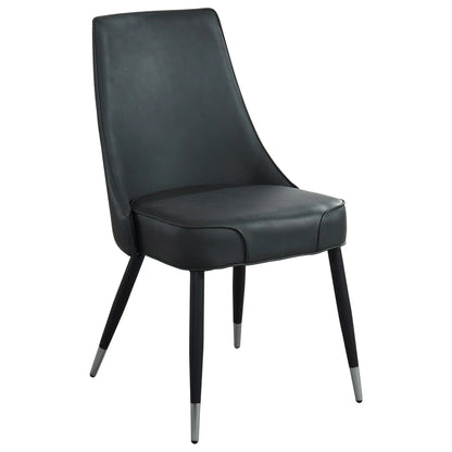 Black leather chair with metal legs on a white background