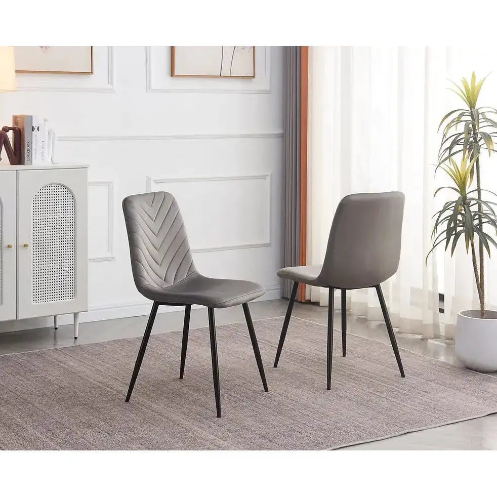 Two grey dining chairs 