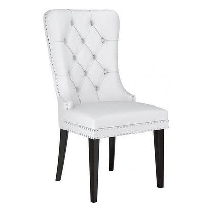 White tufted dining chair with black legs 