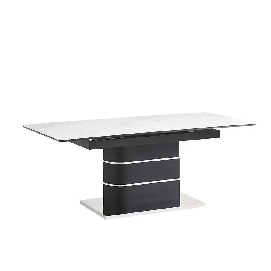Modern dining table with black base and white marble top